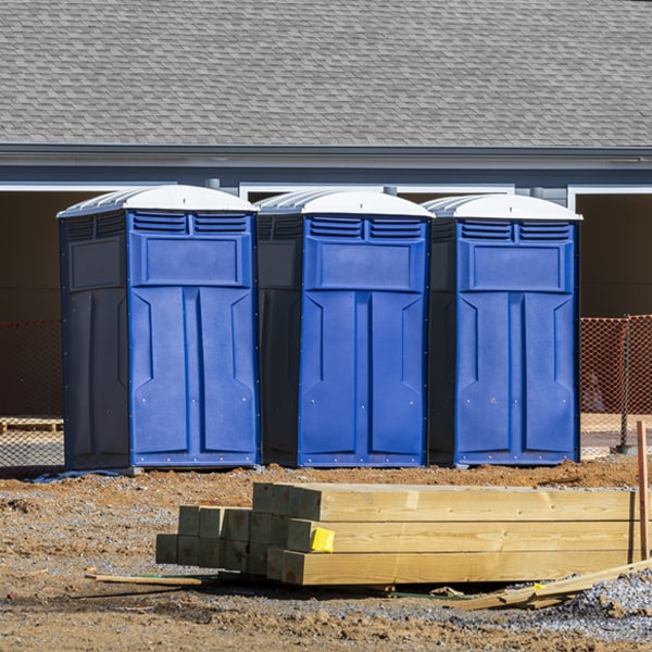 what is the cost difference between standard and deluxe portable restroom rentals in Cora WY